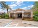 Charming community entrance featuring a well-maintained facade, landscaping, and mailboxes at 891 Lantern Way # 13-103, Clearwater, FL 33765