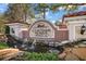 Elegant Coachman Reserve entrance sign with water feature, manicured landscaping and stone accents at 891 Lantern Way # 13-103, Clearwater, FL 33765