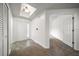 Spacious entryway featuring tiled floors, and ample natural light from the skylight and sidelight at 891 Lantern Way # 13-103, Clearwater, FL 33765