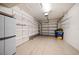 Spacious garage with epoxy flooring and built-in shelving for ample storage space at 891 Lantern Way # 13-103, Clearwater, FL 33765