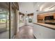 Bright breakfast nook and kitchen with a view of the yard through a large sliding glass door and windows at 891 Lantern Way # 13-103, Clearwater, FL 33765