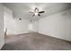 Large living room with carpeted floors, a ceiling fan, and neutral walls with plenty of room at 891 Lantern Way # 13-103, Clearwater, FL 33765