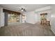 Inviting living room with sliding glass doors, carpeted floors, and an adjacent dining area at 891 Lantern Way # 13-103, Clearwater, FL 33765