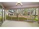 Screened patio overlooking green spaces, providing a serene outdoor retreat at 891 Lantern Way # 13-103, Clearwater, FL 33765