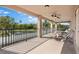 Large balcony with seating overlooking beautiful view of lake, palm trees and blue skies at 9402 59Th N St, Pinellas Park, FL 33782