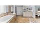 Bright, spacious bathroom featuring soaking tub, walk-in shower, vanity and lots of natural light at 9402 59Th N St, Pinellas Park, FL 33782