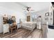 Cozy bedroom featuring modern decor, wood-look floors, a ceiling fan, and great natural light at 9402 59Th N St, Pinellas Park, FL 33782