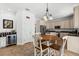 Bright breakfast nook with a wood table and a view into the modern kitchen at 9402 59Th N St, Pinellas Park, FL 33782