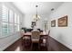 Elegant dining room with hardwood floors, plantation shutters, and an elegant chandelier at 9402 59Th N St, Pinellas Park, FL 33782