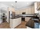 Well-lit kitchen with stainless steel appliances, ample cabinet space, and a center island at 9402 59Th N St, Pinellas Park, FL 33782