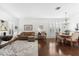 Bright living room with wood floors, plantation shutters, and a comfortable sofa at 9402 59Th N St, Pinellas Park, FL 33782
