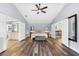 Spacious main bedroom with en-suite bath, wood floors, neutral paint, and a cozy feel at 9402 59Th N St, Pinellas Park, FL 33782
