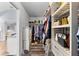 Spacious walk-in closet with custom shelving and hanging racks for optimal organization and storage at 9402 59Th N St, Pinellas Park, FL 33782