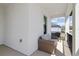 Outdoor balcony with comfortable seating, a wicker-style sofa, and neighborhood views at 9817 Coneflower Ct, Land O Lakes, FL 34637