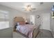 This bedroom features a cozy bed, soft carpet, and natural light, creating a peaceful retreat at 9817 Coneflower Ct, Land O Lakes, FL 34637