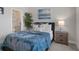 This bedroom is bright, features carpeting, and has an adjacent bathroom at 9817 Coneflower Ct, Land O Lakes, FL 34637