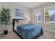 This bedroom offers natural light, carpeting, and neutral decor at 9817 Coneflower Ct, Land O Lakes, FL 34637