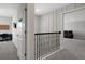 Bright hallway leading to a theater, home office, and other rooms, offering a glimpse into the home's layout at 9817 Coneflower Ct, Land O Lakes, FL 34637