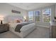 Spacious main bedroom featuring tray ceiling, plush carpet, and lots of natural light at 9817 Coneflower Ct, Land O Lakes, FL 34637