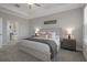 Spacious main bedroom boasts tray ceiling and easy access to main bathroom at 9817 Coneflower Ct, Land O Lakes, FL 34637