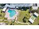 Aerial shot showcasing the community pool, clubhouse, and shuffleboard courts at 100 Bluff View Dr # 614A, Belleair Bluffs, FL 33770