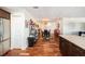 Dining area with hardwood floors next to the kitchen, complete with stainless steel refrigerator at 100 Bluff View Dr # 614A, Belleair Bluffs, FL 33770