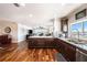Bright, modern kitchen with stainless steel appliances and view of open-concept living space at 100 Bluff View Dr # 614A, Belleair Bluffs, FL 33770