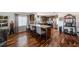 View of kitchen with hardwood floors, stainless steel appliances, and a breakfast bar at 100 Bluff View Dr # 614A, Belleair Bluffs, FL 33770