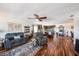 Open-concept living room and kitchen area with hardwood floors and modern furnishings at 100 Bluff View Dr # 614A, Belleair Bluffs, FL 33770