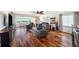 An open living room with scenic views from expansive windows and comfortable seating at 100 Bluff View Dr # 614A, Belleair Bluffs, FL 33770