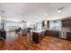 Open-concept kitchen and living area with hardwood floors and plenty of natural light at 100 Bluff View Dr # 614A, Belleair Bluffs, FL 33770