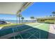 Well-maintained shuffleboard courts with bay views and lush landscaping at 100 Bluff View Dr # 614A, Belleair Bluffs, FL 33770