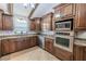 Well-appointed kitchen with granite countertops, stainless appliances, and abundant storage at 10100 Grove Dr, Port Richey, FL 34668