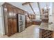 Spacious kitchen offering ample storage, granite countertops, and stainless steel refrigerator at 10100 Grove Dr, Port Richey, FL 34668