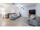 Comfortable living room with a soft sofa and a television for entertainment at 10100 Grove Dr, Port Richey, FL 34668