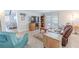 Comfortable living room with tile floor and view of outdoor space at 10100 Grove Dr, Port Richey, FL 34668