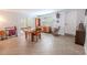 Spacious living area with tile floors, wood furnishings, and access to the outdoors at 10100 Grove Dr, Port Richey, FL 34668