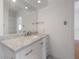 Bathroom with large vanity, marble countertop, and built-in storage at 1014 E Clifton St, Tampa, FL 33604