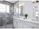 Elegant bathroom with a walk-in shower and a marble countertop vanity at 10385 Winnipeg St, Port Charlotte, FL 33981