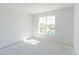 Bright bedroom featuring a large window providing abundant natural light at 10385 Winnipeg St, Port Charlotte, FL 33981