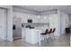 Modern kitchen with white cabinets, stainless steel appliances, and a center island at 10385 Winnipeg St, Port Charlotte, FL 33981