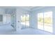 Bright living room featuring recessed lights and sliding glass doors leading to the outdoors at 10385 Winnipeg St, Port Charlotte, FL 33981