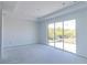 Open living space with recessed lighting and sliding glass doors at 10385 Winnipeg St, Port Charlotte, FL 33981