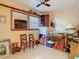 Functional spare room with neutral tile floors, a window, and ceiling fan at 10402 N Boulevard, Tampa, FL 33612