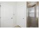 Bathroom area showing a glass shower and doors to a toilet room and linen closet at 13001 Satin Lily Dr, Riverview, FL 33579