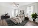 This primary bedroom features ample natural light, stylish decor, and neutral colors to create a relaxing retreat at 13001 Satin Lily Dr, Riverview, FL 33579