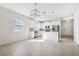 Bright kitchen that opens to the living area features stainless appliances and access to the front door at 13001 Satin Lily Dr, Riverview, FL 33579