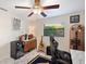 This office features a guitar, mini fridge, desk, and a wine rack at 1308 Gulfview Woods Ln, Tarpon Springs, FL 34689