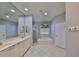 Bright bathroom featuring a double vanity, soaking tub, and separate shower stall at 13719 Artesa Bell Dr, Riverview, FL 33579