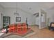 Elegant dining room featuring tile floors, a modern chandelier, and comfortable seating for a delightful gathering at 13719 Artesa Bell Dr, Riverview, FL 33579